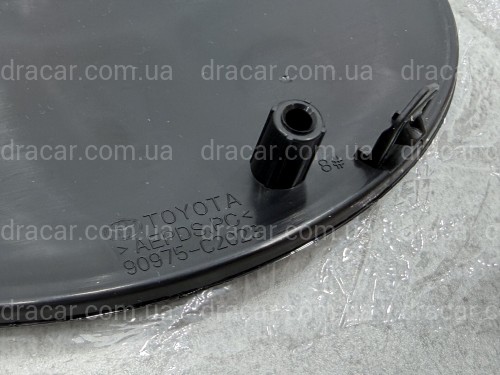 Емблема TOYOTA під ДІСТРОНІК під склом чорна 90975C2023 артикул 10536
